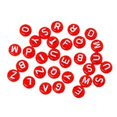 red plastic letters and numbers are arranged in the shape of small round buttons on a white background