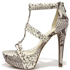 The Jessica Simpson Solena Mojito Snakeskin Dress Sandals Nail All Of This Year's Top Trends With Python Print, A Platform, And A Sexy Caged Upper! Grey And Ivory Faux Leather Is Beautifully Printed Over A Caged Peep Toe Upper, A 1.25" Double Toe Platform, And A Magnificent 5.25" Stiletto Heel. 2.5" Heel Zipper. Cushioned Insole. Cork-Wrapped Rubber Sole Has Nonskid Markings. See Pics For Natural Aging Flaws (Dried Glue Unnoticed When On Feet) Purchased But Never Worn Bought From Lulus $129 Curr Trending Sandals Lulus, Cream Heels For Summer Night Out, White Platform Sandals For Night Out, White Round Toe Sandals For Night Out, Fitted Cream Synthetic Sandals, Fitted White Sandals For Night Out, Snakeskin Dress, Jessica Simpson Sandals, 2015 Fashion Trends