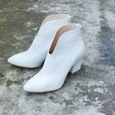 "Gabi - handmade white ankle boots made of high-quality grain leather. The exceptionally soft upper and comfortable leather insole guarantee the highest comfort. The shoes have a fitted upper and a carefully profiled toe, the slim shape visually lengthens the figure. This classic booties will be perfect as your winter wedding shoes. Would you like other color...please let me know High heel 8 cm = 3.2\" Sizes UK, EU, US/ feet dimensions / centimeters and inches 3 UK / 36 EU / 5 US insoles length Winter Wedding Boots, Country Wedding Boots, White Wedding Boots, White Heel Boots, Bride Boots, Comfy Wedding Shoes, Winter Wedding Shoes, Bridal Boots, Women's Slip Ons