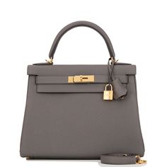 This Kelly, in the Retourne style, is in Etain togo leather with gold hardware and has tonal stitching,front flap, two straps with center toggle closure, clochette with lock and two keys, single rolled handle and removable shoulder strap. The interior is lined in Etain chevre and has one zip pocket with Hermes engraved pull and two open pockets on the opposite side.Collection: ZOrigin: FranceCondition: New (plastic on hardware)Accompanied by: Hermes box, Hermes dustbag, clochette, lock, two keys Hermes Kelly Retourne, Hermes Box, Togo Leather, Dior Shoes, Gold Hardware, Luxury Bags, Zip Pockets, Second Hand, Dust Bag