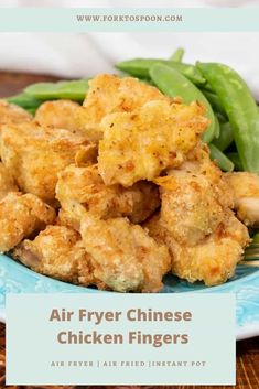 air fryer chicken fingers on a blue plate with green beans