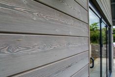 the side of a house with wood siding