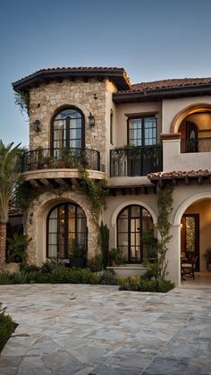 a large house with many windows and balconies