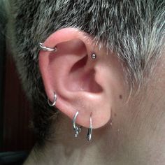 a person with ear piercings on their ears