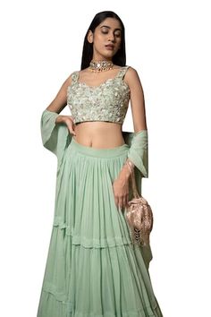 Green attached cancan pleated lehenga. Paired with a floral zardosi, pearl, bead and zari embroidered padded blouse and dupatta. - Aza Fashions Fitted Ruffles Anarkali Set For Festivals, Ruffled Lehenga For Wedding And Festivals, Wedding Lehenga With Ruffles For Festivals, Traditional Drape Skirt Set For Wedding, Fitted Cutdana Skirt Set For Reception, Fitted Ruffle Sets For Reception, Fitted Cutdana Skirt Set For Wedding, Tiered Lehenga, Pleated Lehenga