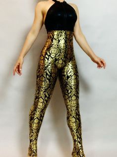 ..Elegant Royal Gold/black ooen back catsuit, costume for dancers, outfit for festival. Top- Black open back Bottom - high waisted pants (connected) Zipper front 4 way stretch Lycra fabric. Top quality gold metallic print and black hologram Lycra. Contact me if you like to switch top to the bottom fabrics or offer other fabric you like for this design. Get creative No extra charge for custom sizes or colors  . This beautiful costume is good for aerial shows, contortionist , acrobatic and dance competitions. Standard size or custom made by toys measurements is same price. Yes we make for man as well, most of our product is unisex.  Pick your size using this basic scale  XSmall: Fits women -men 85-105 lbs (and 5'4" tall and under) Small: Fits women- men 105 to 130 lbs Medium: Fits women - me Fitted Backless Leotard For Party, Gold Fitted Bodysuit For Club, Fitted Backless Party Leotard, Gold Fitted Elegant Bodysuit, Elegant Fitted Gold Bodysuit, Stretch Dancewear Bodysuit For Costume Party, High Stretch Full-length Party Jumpsuit Or Romper, Full Length Stretch Unitard For Party, Full Length High Stretch Jumpsuit For Parties