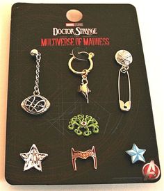 an assortment of different types of earrings on a black board with the title doctor strange multiverse of mainness