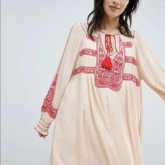 Free People Embroidered Dress Cream Red Embroidery Oversized W?Slips Oversized With Shirring On The Sleeves & Tassel Tie Around The Neck New With Tags * Size: X Small Retail Price: $168.00 60’’ Around The Bust 70’’ Around The Waist 42" Long Check Out My Other Item! Be Sure To Add Me To Your Favorites List! Long Sleeve Embroidered Folk Peasant Dress, Folk Style Long Sleeve Embroidered Peasant Dress, Red Spring Dresses With Intricate Embroidery, Red Dresses With Intricate Embroidery For Spring, Red Bohemian Embroidered Dress With Intricate Embroidery, Folk Style Long Sleeve Dresses For Daywear, Long Sleeve Folk Dresses For Daywear, Long Sleeve Embroidered Dress For Daywear, Red Bohemian Embroidered Dress With V-neck