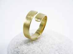 Bypass ring Wrap around ring Open gold ring  Minimalistic statement ring Modern gold ring.A beautifully simple yet sophisticated open bypass ring.Clean minimalist modern design with matt-brush texture that adds a chic style !Bandwidth ~5-6mmRing made of 24k gold plating (3 micron,thick and durable with a year warranty)***COSTOM ORDER RING***If you prefers silver jewelry - this ring can also be made in sterling silverAll you need is just specify gold /silver in your order.For custom order please Gold Minimalist Open Band Bypass Ring, Gold Minimalist Bypass Promise Ring, Minimalist Gold Bypass Ring For Wedding, Modern Gold Bypass Ring For Wedding, Modern Gold Bypass Wedding Ring, Gold Modern Bypass Wedding Ring, Gold Minimalist Bypass Ring, Modern Gold Ring, Open Ring Gold