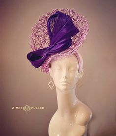 Structured, chic criss-cross woven material on this asymmetrical showpiece. Luscious purple silk ribbon feature.   Easy-to-wear headband fascinator makes a statement, and can be worn to a myriad of events: Easter, Bridal, Derby-Wear, Del Mar Races, Hat Contests, Church, Gala, Kentucky Derby, Melbourne Cup, High Tea, Weddings, Cocktail Parties, Weddings, and More.  Some customization available as this is made-to-order; please message with your requests to see if we can meet your needs. Other colors available; please inquire before purchase if you need another color. Please note: this one particular piece is made-to-order, and has an extended handling time.  *FREE SHIPPING  For more STATEMENT JEWELRY and HANDMADE HATS go to www.aimeesfuller.com Aimee Fuller has been a trusted online seller s Chic Fitted Top Hat With Structured Crown, Fitted Hat For Fashion Events In Spring, Elegant Fitted Headpieces For Fashion Events, Fitted Hat With Curved Brim For Fashion Events, Purple Top Hat For Royal Ascot, Fitted Purple Hat For Kentucky Derby, Elegant Purple Top Hat With Curved Brim, Lavender Fitted Hat With Curved Brim, Purple Fitted Top Hat With Curved Brim