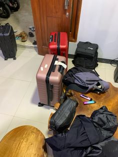 several pieces of luggage sitting on the floor