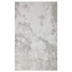 a gray rug with white and grey paint on it