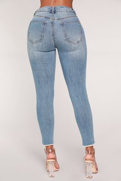 Available In Light Blue Wash High Rise Stretch Denim 5 Pockets Fray Hem 26" Inseam Disclaimer: Due To The Specialized Wash Process. Each Item Is Unique. 64% Cotton 32% Polyester 2% Rayon 2% Spandex Imported Stretch Cropped Jeans With Frayed Hem In Medium Wash, Mid-rise Denim Jeggings With Frayed Hem, Stretch Denim Bottoms With Frayed Hem, Mid-rise Medium Wash Jeggings With Frayed Hem, Mid-rise Denim Blue Bottoms With Frayed Hem, Blue Mid-rise Denim Jeggings, Denim Blue Stretch Cropped Jeans, Fitted Washed Blue Bottoms With Frayed Hem, Light Wash Denim Jeggings