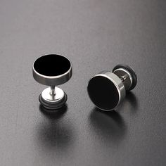 Unleash your inner style maverick with our Men's Stainless Steel Stud Earrings in sleek black. Crafted for the modern trendsetter, these earrings blend contemporary edge with timeless sophistication. Forged from high-quality stainless steel, these studs exude durability and resilience, ensuring they stand the test of time. The sleek black finish adds a touch of understated elegance, making them versatile enough to complement any ensemble, whether casual or formal. With a minimalist design, these earrings offer a subtle yet impactful accent to your look, effortlessly elevating your style game. Lightweight and comfortable to wear, they are perfect for everyday wear or special occasions, adding a dash of confidence and charisma to your persona      Earrings Height: 10mm Width: 10mm     Materi Adjustable Matte Black Modern Jewelry, Modern Matte Black Adjustable Jewelry, Modern Internally Threaded Adjustable Earrings, Minimalist Nickel-free Black Jewelry, Black Stainless Steel Jewelry With Black Enamel, Modern Internally Threaded Metal Plug Earrings, Modern Adjustable Black Jewelry, Modern Stainless Steel Earrings, Modern Matte Black Jewelry For Formal Occasions