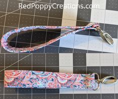 the strap is being used to make a key chain for this dog collar and leash