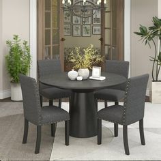 a round table with four chairs around it