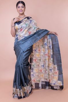 This grey tussar silk saree has a simple motif. A bird is sitting on a tree branch. However, our designers have used it in different settings. Something really simple like a bird sitting on a tree can become exceptional when you can visualize it for extraordinary circumstances. This grey tussar silk saree depicts the rich heritage of Indian design. As you can see, the body of the saree is completely different from any other pure tussar silk sarees. We make sure our sarees are handcrafted. So you can understand why our sarees are always in demand. A multi-purpose saree You can use it as your office wear or for your after-office parties. As a tussar silk sarees boutique from India, we are aware of the fact that how to create an iconic saree. You carry your aura when you wear it. At Ramdhanu Western Outfits Women, Silk Saree With Blouse, Indian Textiles, Stylish Sarees, Tussar Silk Saree, Style Expert, Saree With Blouse, Beautiful Saree, Indian Design