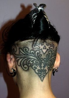 a woman with a tattoo on her head