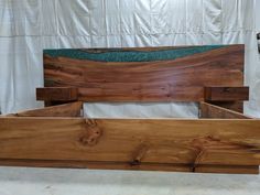 a wooden bed frame made out of wood