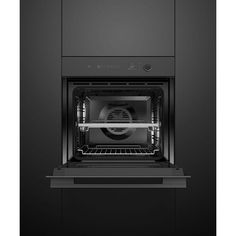 an oven with the door open on a black background