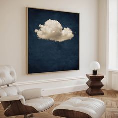 an empty room with two chairs and a large painting on the wall above it that has a white cloud floating in the sky