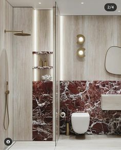 a modern bathroom with marble walls and flooring, including a white toilet next to a walk in shower