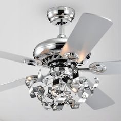 a chrome ceiling fan with crystal chandelier