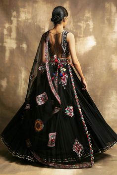 Black lehenga with embroidered waistband and seashell, metal tassel detail. Paired with geometric and floral embroidered blouse and sheer embroidered dupatta.
Component: 3
Embroidered
Neckline: V neck
Sleeve Length: Sleeveless
Fabric: Cotton, Net
Color: Black
Back and side tassel tie-up
Sequin work - Aza Fashions Black Lehenga, Embroidered Lehenga, Embroidered Neckline, Black Back, Embroidered Blouse, Back To Black, Set For Women, Aza Fashion, Black Cotton