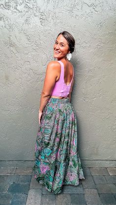 Experience country vibes in the Fern Boho Skirt. Perfect for summer nights, weekends at the lake, or bonfires on the beach, this skirt will have you looking and feeling your best everywhere you go. The beautiful green and pink paisley design with pops of teal adds a splash of color that is sure to turn heads. Not only will you look great, but lightweight material ensures maximum comfort all night long. A flattering waistband and flowing fit further emphasize your figure in all the right ways. Pl Green Bohemian Bottoms With Floral Print, Bohemian Green Skirt For Summer, Green Bohemian Maxi Skirt For Summer, Bohemian Green Maxi Skirt For Summer, Bohemian Green Maxi Skirt For Vacation, Green Lined Skirt Bottoms For Festival, Green Maxi Skirt With Elastic Waistband For Vacation, Bohemian Green Skirt For The Beach, Hippie Green Maxi Skirt For Vacation