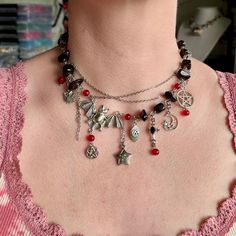 Elevate your Halloween ensemble with this unique upcycled Halloween necklace featuring a stunning combination of black and red beads. Adorned with exquisite vintage pendants, each piece exudes a touch of old-world charm. Crafted with durable stainless hardware, this Halloween necklace is not only stylish but also versatile. Perfect as a statement piece or as a thoughtful gift for her this Halloween, this necklace is sure to add an intriguing and spooky flair to any outfit. ✤length : 14 inch + 1 Black Vampire Jewelry For Festival, Vampire Style Black Jewelry For Festivals, Gothic Dangle Necklaces For Halloween, Black Halloween Necklace With Lobster Clasp, Vintage Black Necklace For Halloween, Vampire Style Halloween Necklace For Jewelry Making, Handmade Black Vampire Necklace, Halloween Festival Jewelry With Black Beads, Halloween Festival Black Beaded Jewelry