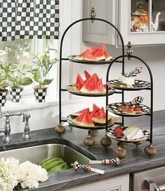 watermelon slices are arranged on trays in the kitchen