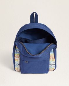 Experience effortless organization and durability with our Opal Springs Canopy Mini Backpack. Made from sturdy canvas and coated with matte PVC, this compact backpack is resistant to dirt, stains, and water, making it the perfect choice for any adventure. Features a zip closure, hanging loop, adjustable straps, and multiple pockets, including an interior slip pocket and an exterior zippered pocket with a wipe-clean lining, this backpack is both functional and stylish. Please note, pattern placem Functional Camping Backpack With Adjustable Strap, Blue Outdoor Backpack With Zipper Pocket, Outdoor Canvas Softback Backpack, Outdoor Backpack With Adjustable Strap And Softback, Outdoor Activities Softback Backpack With Adjustable Strap, Canvas Softback Backpack For Outdoor, Adjustable Backpack With Zipper For Everyday Use, Canvas Backpack With Zipper For Outdoor Activities, Casual Camping Bag With Adjustable Strap