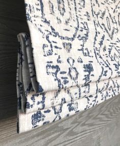 an up close shot of a blue and white area rug