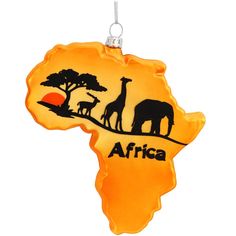 an ornament shaped like the shape of africa with giraffes and trees