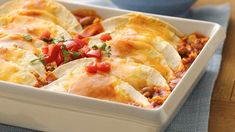 a casserole dish filled with meat and vegetables