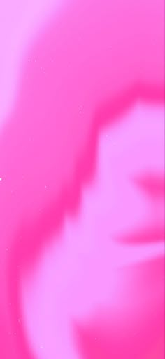 a blurry pink background with an airplane flying in the sky