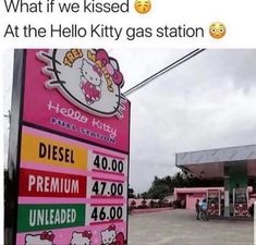 a hello kitty gas station sign in front of a building