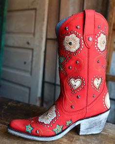 DESCRIPTION The Liberty Black Anabella Nubuck Grace Rojo Boot combines classic western style with whimsical details like a flower heart and star inlay, star and circle studs, and intricate stitching. Stand out from the crowd with this vibrant red cowboy boot, featuring a convenient zipper for easy on and off. Measurements: Shaft Height - 11" Heel Height - 2" Toe - Snip Standard Width Measurements are based on size 8 - measurements may vary slightly based on size Sizing: Fits true to size Cowgirl Things, Boy Boots, Red Cowboy Boots, Ethiopian Opal Ring, Cute Nike Shoes, Cute Nikes, Circle Studs, Cow Boy, Cowboy Boot