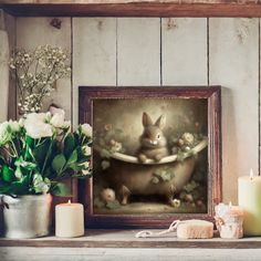 a painting of a bunny taking a bath in a tub with flowers and candles around it