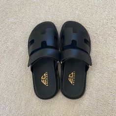 -Brand New, Never Worn -Size 6 Women’s -Tagged Brand For Exposure Classic Black Slides With Textured Footbed, Black Slide Mules With Textured Footbed, Black Slippers With Removable Insole And Closed Toe, Black Slide Mules With Removable Insole, Classic Black Slip-on Slides, Beach Black Mules With Textured Footbed, Classic Black Slides With Rubber Sole, Classic Black Flat Slides, Black Textured Slip-on Mules