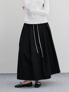 It is a maxi pleated skirt with drawstring point. The skirt is made of nylon blend cotton fabric and has wrinkled texture. The skirt has drawstring on the waist to adjust the size.- Elastic band waist- Side pockets- Pleated skirt- Maxi length Cotton Maxi Skirt With Drawstring And Relaxed Fit, Cotton Maxi Skirt With Drawstring, Relaxed Midi Skirt With Drawstring, Chic Cotton Skirt With Drawstring, Black Cotton Maxi Skirt With Elastic Waistband, Flowy Long Skirt With Drawstring, Maxi Pleated Skirt, Pleated Maxi Skirt, Skirt Maxi