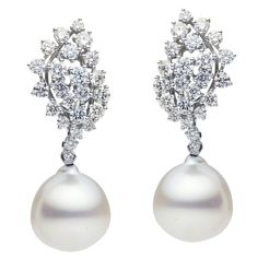 18k white gold diamond drop earrings with 46 round brilliant cut diamonds weighing 2.77 carats total of G color, VS2 clarity. Pearls measure 13-14mm in width. This item is currently out of stock. Please allow 4-6 weeks for delivery. Please note this item is a special order and non-refundable. Due to fluctuation in gold and diamonds prices are subject to change. Gold Hanging Earrings, Gold Diamond Drop Earrings, Sea Pearl, South Sea Pearls, Sea Pearls, Hanging Earrings, Diamond Drops, Diamond Drop Earrings, Pearl Drop Earrings