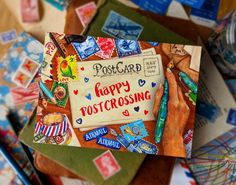 a postcard with the words happy postcrossing surrounded by many different types of stamps