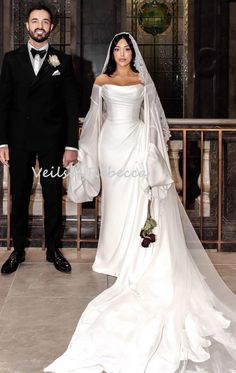 a bride and groom posing for a photo in front of the alter at their wedding