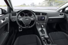 the interior of a car with dashboard and steering wheel