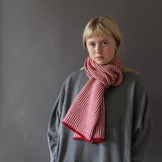 This is a soft, 100% lambswool classic vertical striped scarf for everyday stylish warmth! After knitting, the lambswool is washed until it becomes soft and slightly felted. The narrow two colour stripe ends with a chequered border and would look great on both boys and gals! It comes in 2 colours - black and white, as well as red and white. Dimensions 175cm x 28cm 100% lambswool, knitted in Norfolk Hand wash Knitted Rainbow, Narrow Scarf, Knitted Scarves, Breton Stripes, Rainbow Scarf, Striped Scarf, Striped Scarves, Warm Scarf, Red And White Stripes