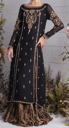 Admirable black peshwas is a multi layered ensemble with sequin stitched net and two tone shimmer fabric. The bodice and sleeves are heavily embellished with florals comprising of resham, zardozi, cut dana, sequin and chain stitches. Colorful resham and zari border on the hem gives the sparkle yet being subtle. Color: Black Fabric: Net Work Details: Embroidered Net Shirt, Pakistani Formal Dresses, Black Lehenga, Pakistani Party Wear, Pakistani Wedding Outfits