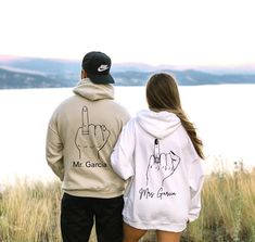 These cute Personalized Wedding Gift for Couple makes great matching shirts that are great as a Custom Bride Sweatshirt or for the Couple Engagement Gift. This bridal gift for the groom from Bride shirt is a perfect gift for her new fiance or husband. Our Mr & Mrs Honeymoon Shirts are great for showing off your new titles as the new Bride & Groom! This hoodie and sweatshirt could be used as the Bride's bachelorette gift also, showing off her new or upcoming Mrs. status! Each Mr. and Mrs. sweatsh Mr And Mrs Hoodies Weddings, Matching Bride And Groom Sweatsuits, Bride And Groom Sweat Suits, Honeymoon Outfits Couple, Wedding Sweatsuit, Honeymoon Sweatshirt, Bachelorette Bride Gifts, Airport Fit, Unique Engagement Gifts