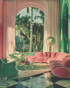 a living room filled with pink couches and green chairs in front of large windows