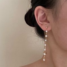 Long earrings with mini baroque pearls Pearl Earrings With Pearl Chain As Gift, Pearl Chain Earrings As A Gift, White Pearl Chain Earrings As Gift, Pearl White Earrings With Pearl Chain As Gift, White Pearl Drop Dangle Earrings, Pearl White Drop Earrings, Single Drop Pearl Earring, Pearl White Pearl Drop Earrings, Single Long Drop Pearl Earring